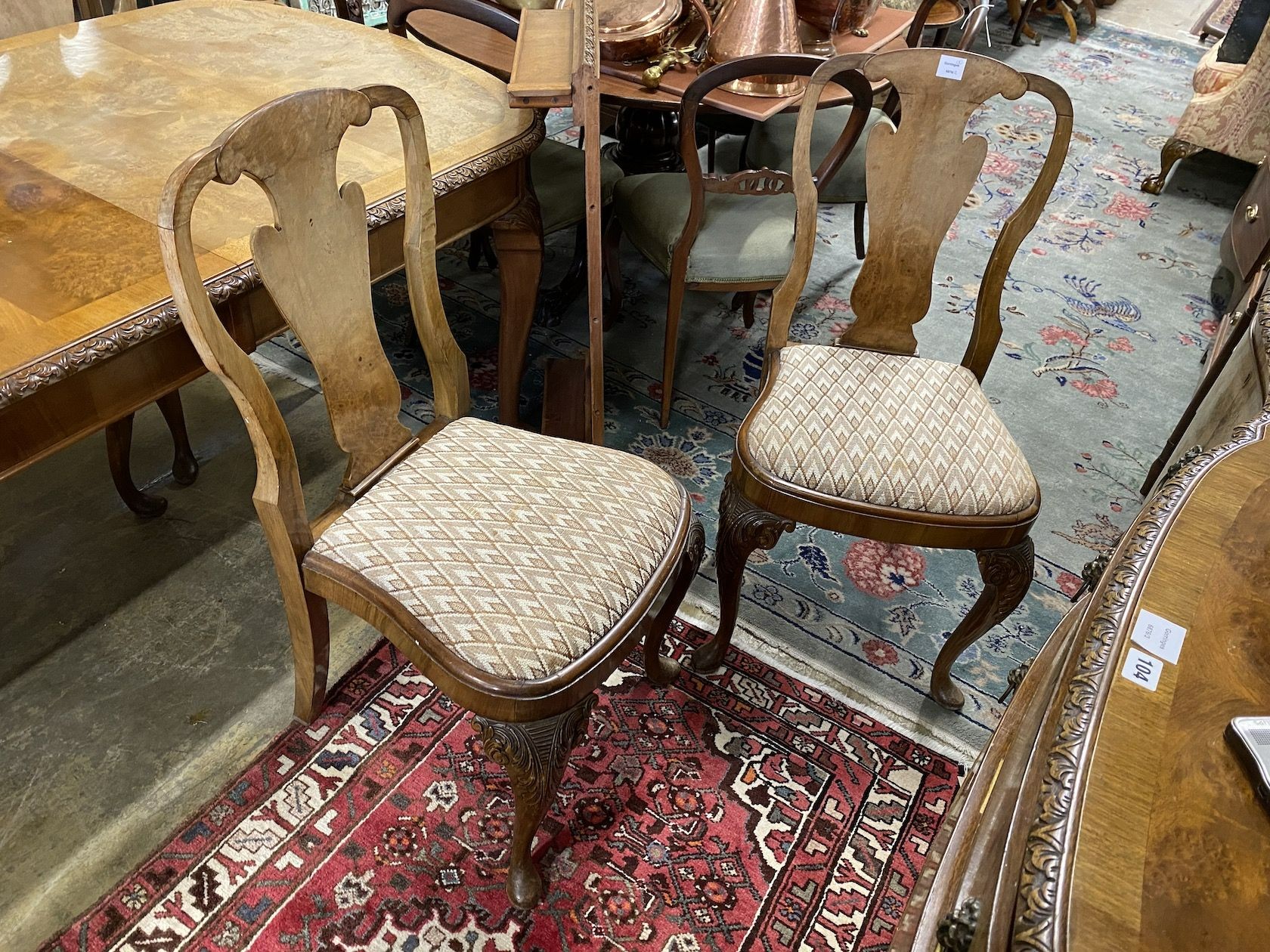 A set of eight Queen Anne revival walnut dining chairs, (two with arms, six single)